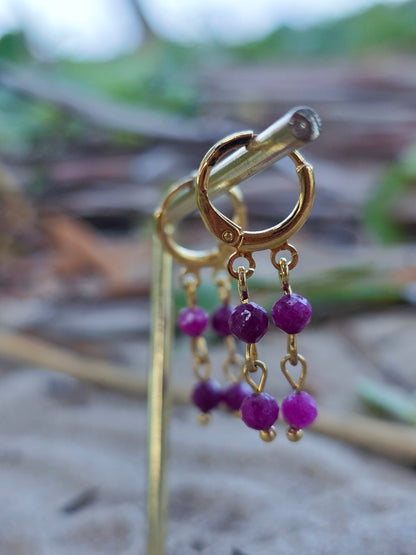 Brincos fluidos de rubi